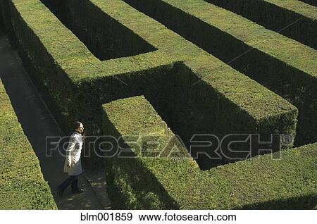 High angle view of woman in labyrinth View Large Photo Image Stock Photo - High angle view of woman in labyrinth. Fotosearch