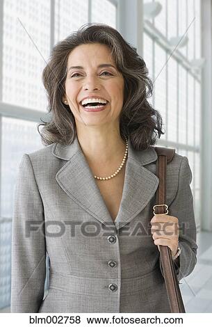 Hispanic businesswoman laughing View Large Photo Image Stock Photo - Hispanic businesswoman laughing. Fotosearch