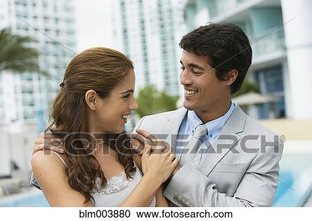 Hispanic couple hugging poolside View Large Photo Image Stock Image - Hispanic couple hugging poolside. Fotosearch