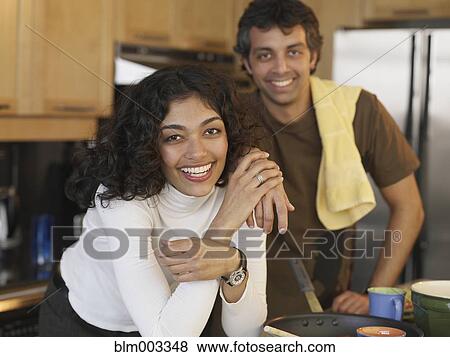 Hispanic couple in kitchen View Large Photo Image Stock Photo - Hispanic couple in kitchen. Fotosearch