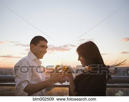 Hispanic couple toasting with champagne View Large Photo Image Stock Photo - Hispanic couple toasting with champagne. Fotosearch