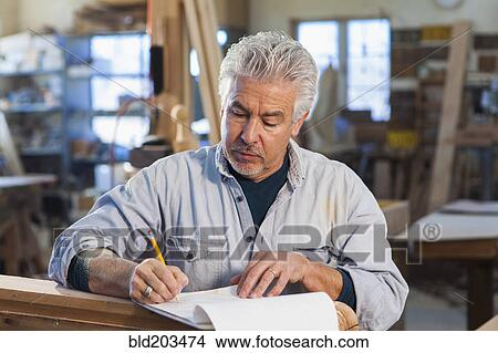 Picture - Hispanic craftsman working in studio. Fotosearch