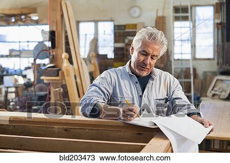 Hispanic craftsman working in studio View Large Photo Image Stock Image - Hispanic craftsman working in studio. Fotosearch