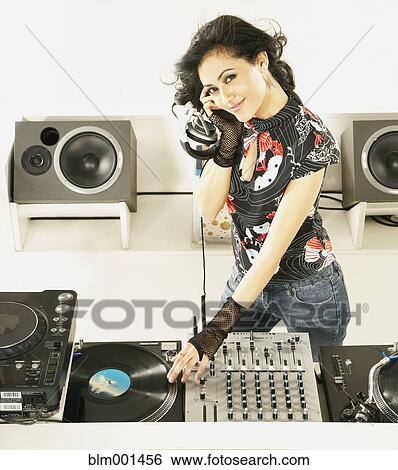 Hispanic dj with turntable and sound mixer View Large Photo Image Stock Photograph - Hispanic dj with turntable and sound mixer. Fotosearch