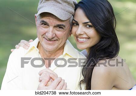 Hispanic father and daughter smiling outdoors View Large Photo Image Stock Photo - Hispanic father and daughter smiling outdoors. Fotosearch