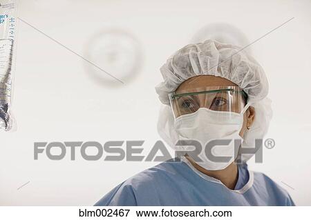 Stock Photo - Hispanic female medical professional wearing protective eyewear. Fotosearch