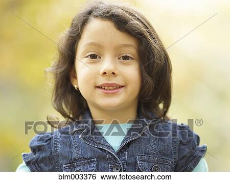 Stock Photograph - Hispanic girl smiling. Fotosearch