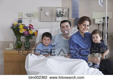 Hispanic male hospital patient with family View Large Photo Image Stock Image - Hispanic male hospital patient with family. Fotosearch