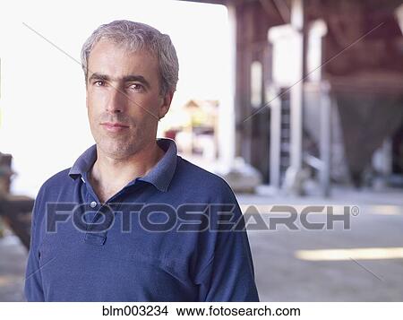 Picture - Hispanic man in factory. Fotosearch