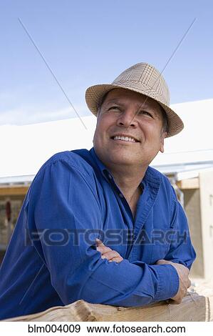 Stock Photo - Hispanic man wearing fedora. Fotosearch