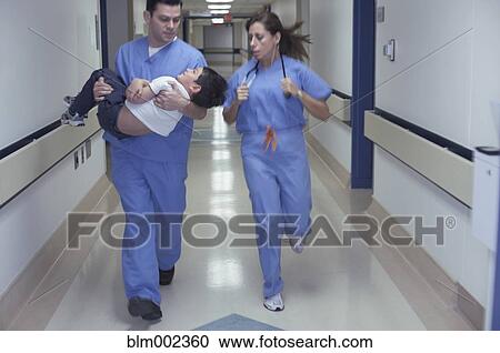 Hispanic medical professionals running with patient View Large Photo Image Stock Image - Hispanic medical professionals running with patient. Fotosearch