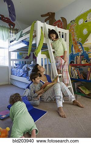 Hispanic mother with children in bedroom View Large Photo Image Stock Image - Hispanic mother with children in bedroom. Fotosearch