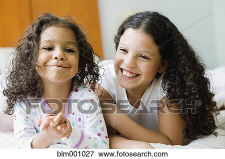 Hispanic sisters laughing View Large Photo Image Stock Photo - Hispanic sisters laughing. Fotosearch