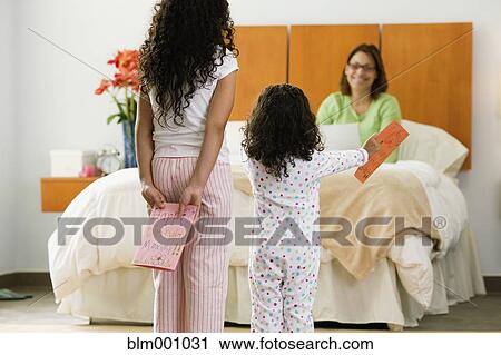 Hispanic sisters with birthday card for mother View Large Photo Image Stock Image - Hispanic sisters with birthday card for mother. Fotosearch