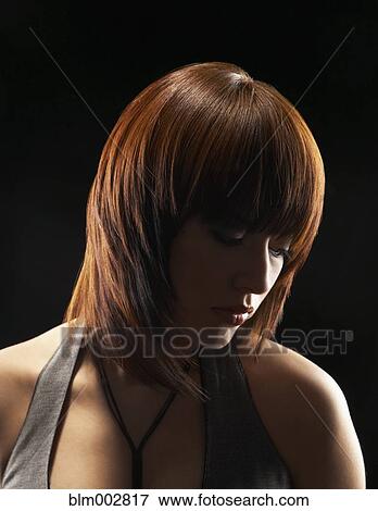 Hispanic woman looking down View Large Photo Image Stock Photo - Hispanic woman looking down. Fotosearch