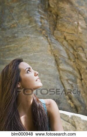 Hispanic woman looking up View Large Photo Image Stock Photo - Hispanic woman looking up. Fotosearch