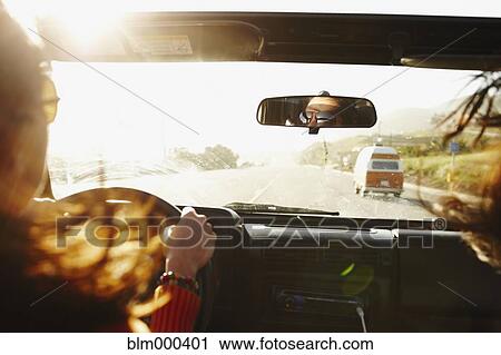 Stock Image - Hispanic woman on roadtrip. Fotosearch