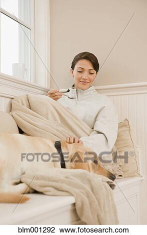 Hispanic woman petting dog View Large Photo Image Stock Image - Hispanic woman petting dog. Fotosearch