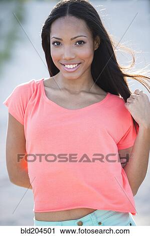 Hispanic woman smiling outdoors View Large Photo Image Stock Image - Hispanic woman smiling outdoors. Fotosearch