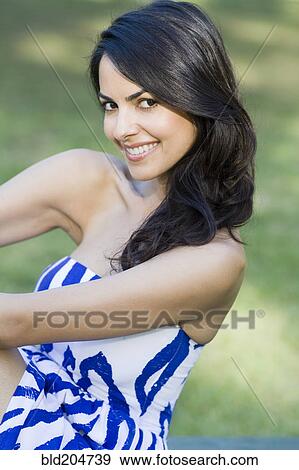 Hispanic woman smiling outdoors View Large Photo Image Stock Photo - Hispanic woman smiling outdoors. Fotosearch