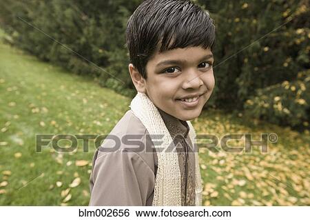 Stock Photograph - Indian boy wearing scarf. Fotosearch