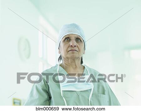 Stock Photo - Indian surgeon in surgical cap and mask. Fotosearch
