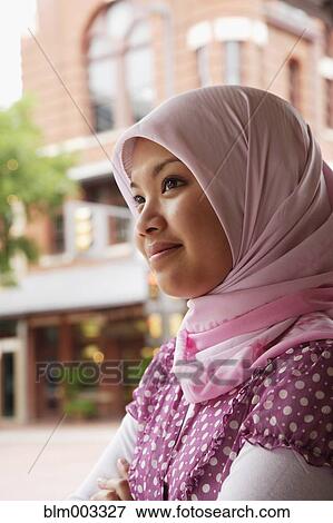 Stock Photo - Indonesian teenager wearing headscarf smiling. Fotosearch
