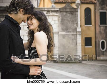 Italian couple hugging outdoors View Large Photo Image Stock Photo - Italian couple hugging outdoors. Fotosearch