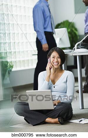Japanese businesswoman working on office floor View Large Photo Image Stock Photography - Japanese businesswoman working on office floor. Fotosearch