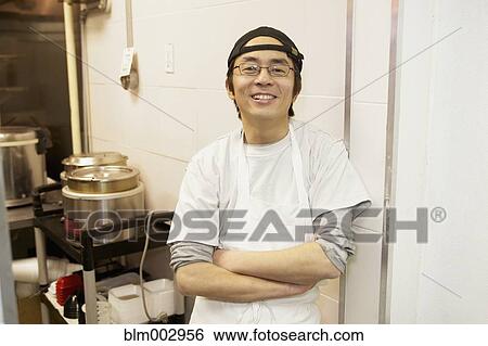 Japanese chef smiling in commercial kitchen View Large Photo Image Stock Photograph - Japanese chef smiling in commercial kitchen. Fotosearch