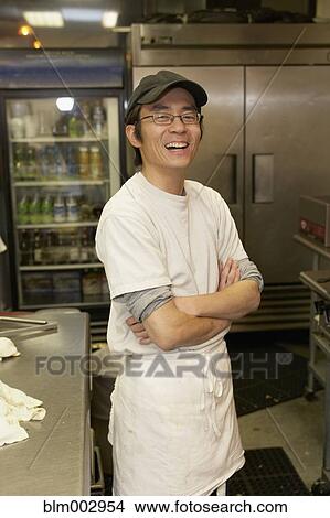 Picture - Japanese chef smiling with arms crossed. Fotosearch