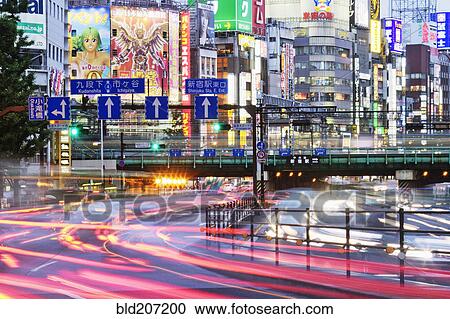 Stock Image - Japanese Downtown Traffic At Dusk. Fotosearch