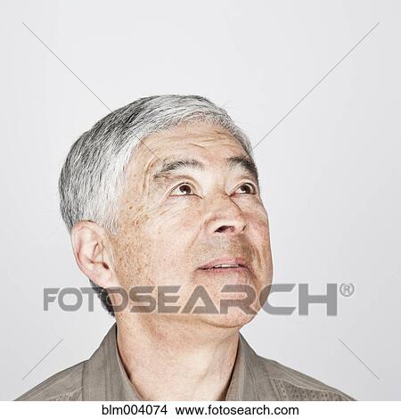 Japanese man looking up View Large Photo Image Picture - Japanese man looking up. Fotosearch