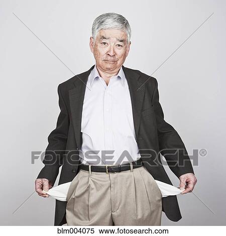 Japanese man showing empty pockets View Large Photo Image Stock Photography - Japanese man showing empty pockets. Fotosearch