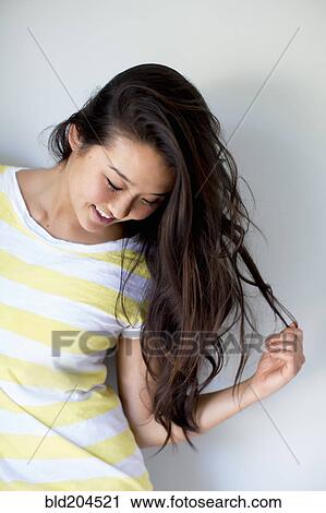Stock Image - Japanese woman smiling. Fotosearch