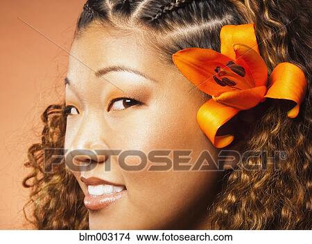 Japanese woman with exotic flower in her hair View Large Photo Image Picture - Japanese woman with exotic flower in her hair. Fotosearch