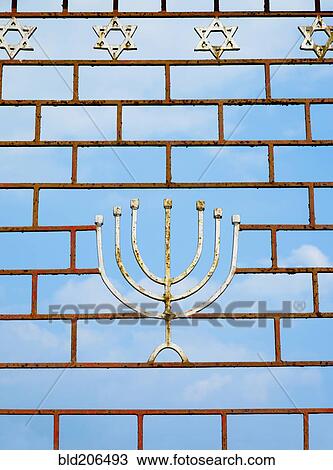 Stock Image - Jewish Gate With a Menorah. Fotosearch