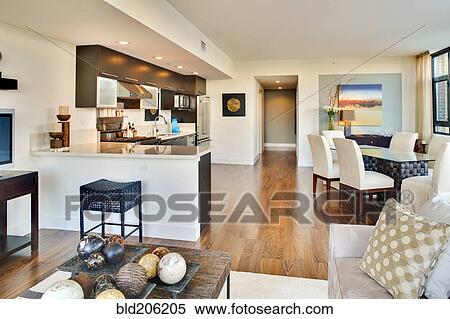 Stock Photography - Kitchen and dining room of open floor plan. Fotosearch