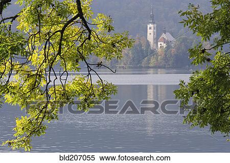 Stock Photography - Lake with Church of the Assumption in Background. Fotosearch