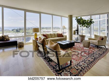 Stock Photo - Living room in luxury highrise apartment. Fotosearch