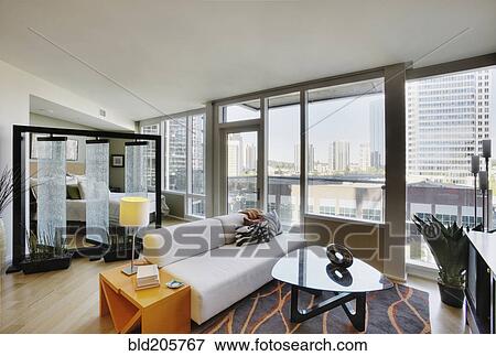 Stock Photo - Living room in luxury highrise apartment. Fotosearch