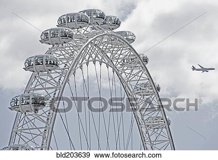 Stock Photo - London Eye in blue sky, London, London, England. Fotosearch