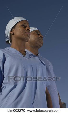 Stock Image - Low angle view of African American medical professionals. Fotosearch