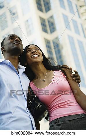 Low angle view of African couple View Large Photo Image Picture - Low angle view of African couple. Fotosearch