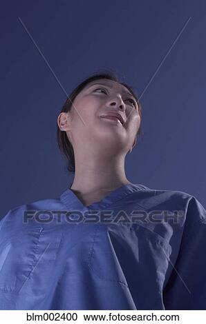 Low angle view of Asian female medical professional View Large Photo Image Stock Image - Low angle view of Asian female medical professional. Fotosearch