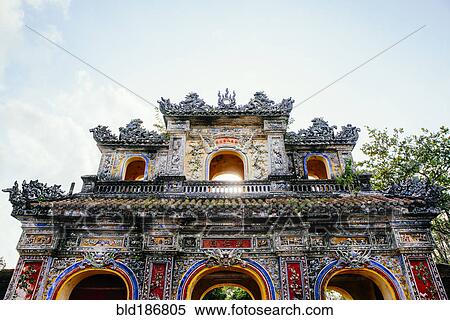 Stock Photography - Low angle view of ornate building facade under clouds. Fotosearch