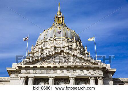 Stock Image - Low angle view of ornate building under blue sky. Fotosearch