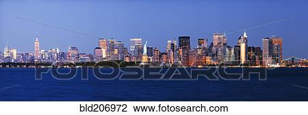 Stock Image - Lower Manhattan Skyline at Dusk. Fotosearch