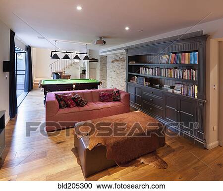 Stock Image - Luxury home library with pool table. Fotosearch