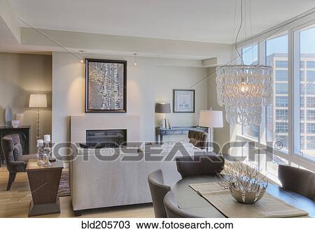 Stock Image - Luxury living room in highrise apartment. Fotosearch
